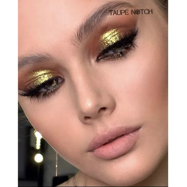 Taupe glitter eye makeup with yellow-gold sparkle across eyelids