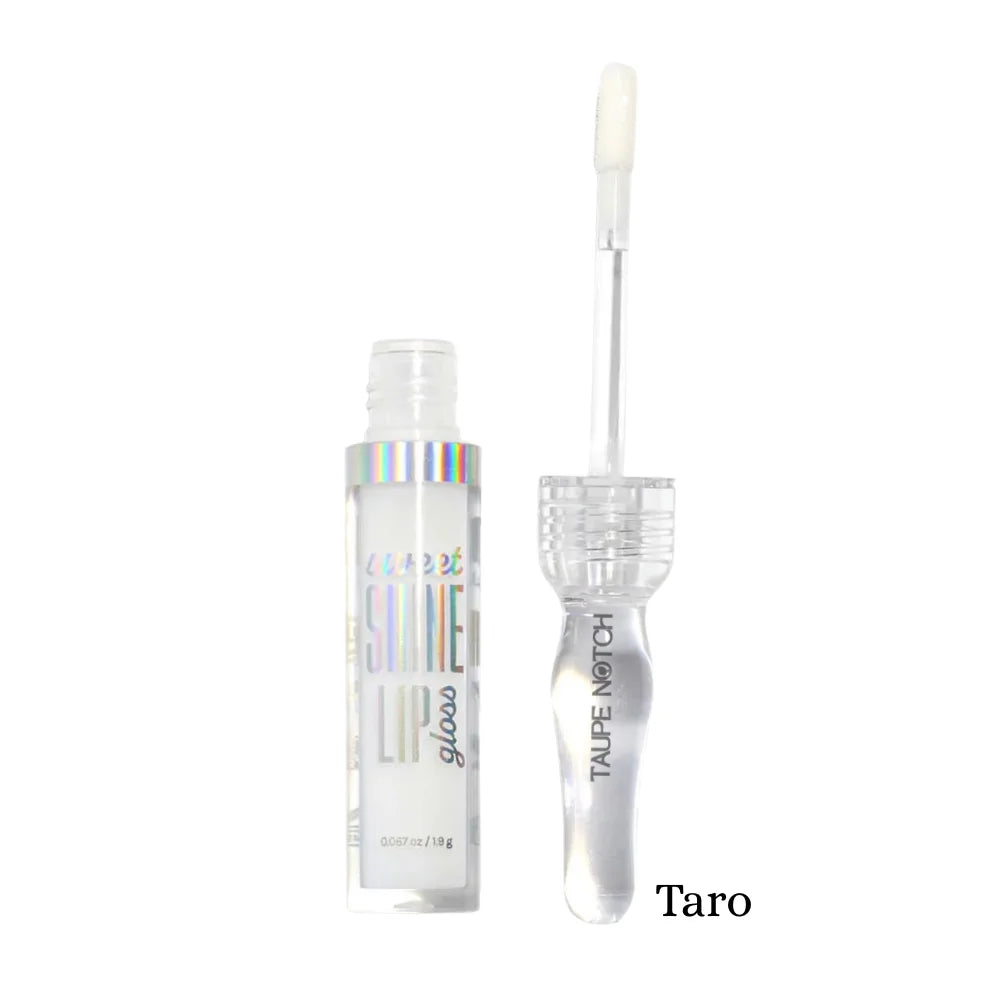 Lip gloss in Taro shade with clear tube and pale, creamy gloss applicator wand