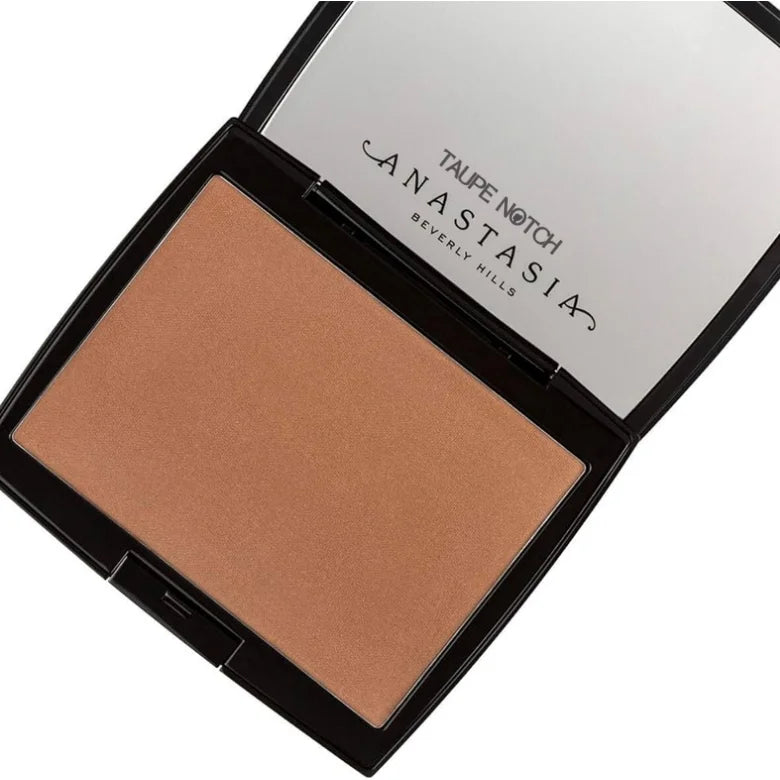 Open powder bronzer compact showing taupe-brown shade pan and mirror lid