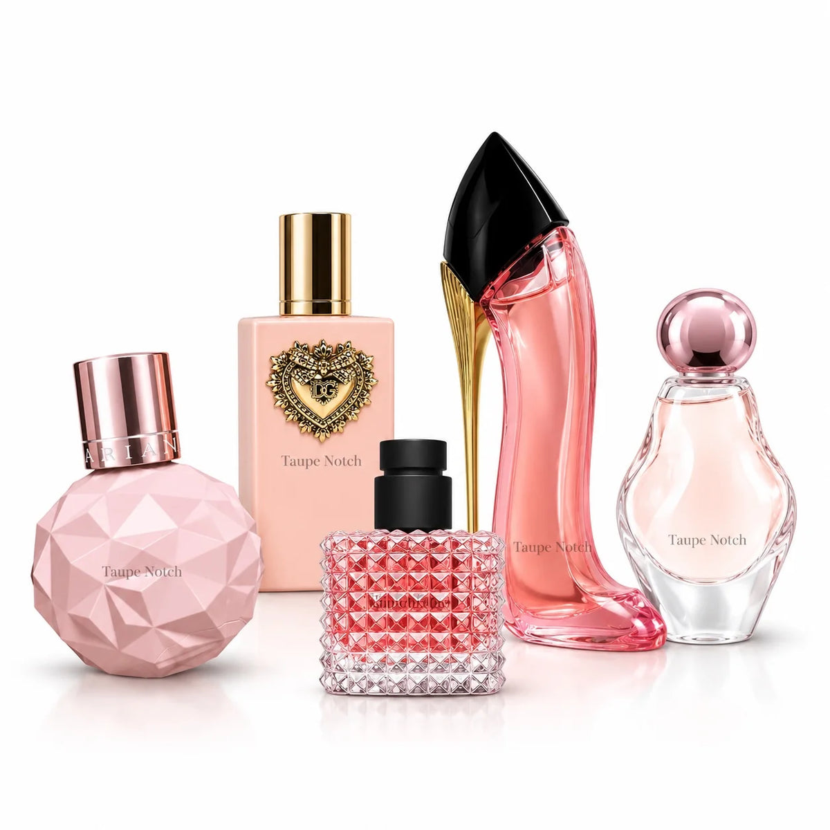 Assorted mini perfume bottles with pink and gold caps in a sampler set