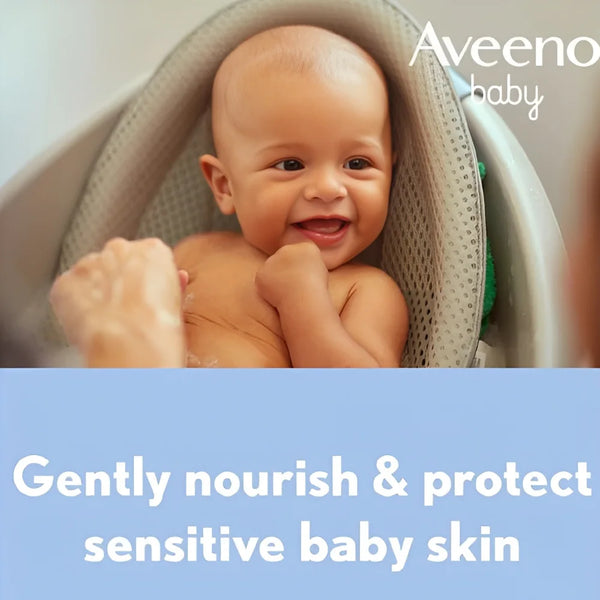 Aveeno baby sensitive skin care concept with smiling infant in blanket