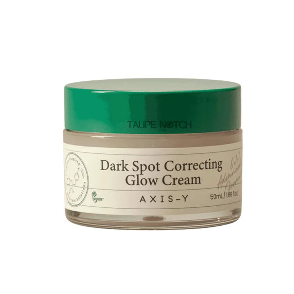 Axis Y dark spot correcting glow cream jar with green lid and beige label