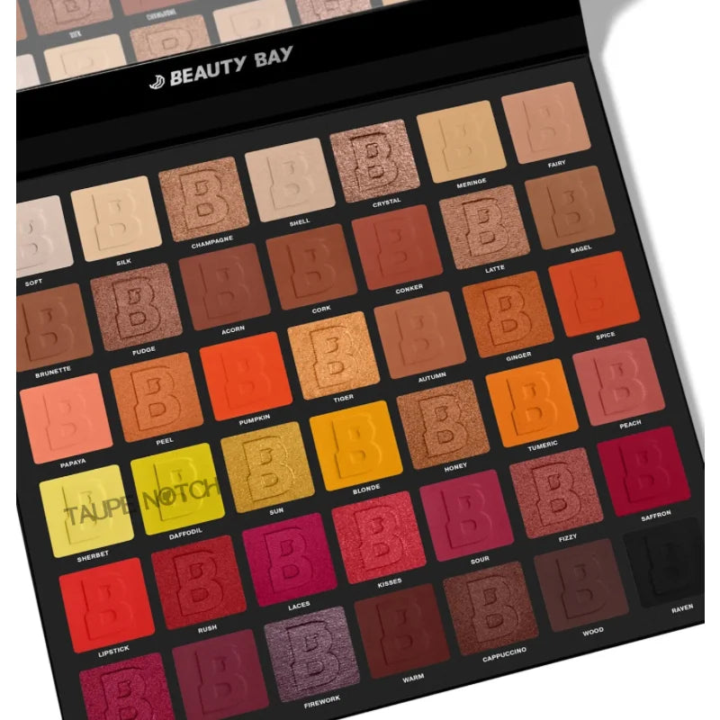 Beauty Bay eyeshadow palette showing 42 square pans in warm red, brown, and gold tones