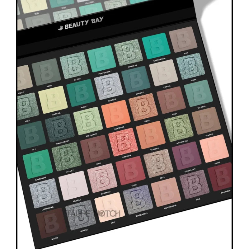 Angled 42-pan botanical eyeshadow palette with green, teal, peach, and plum pans