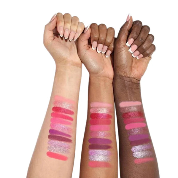 Berry eyeshadow swatches on forearms with finger nails