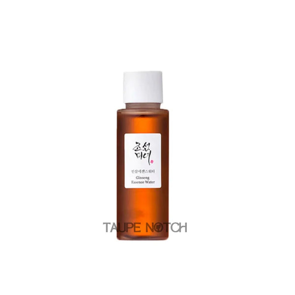 Ginseng essence water bottle with amber glass and white cap, front label close-up