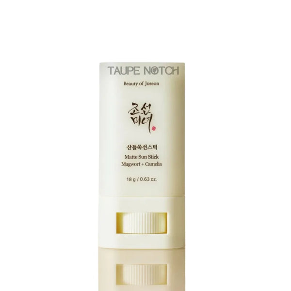 Matte sun stick SPF tube in cream color with printed label and vertical embossed text