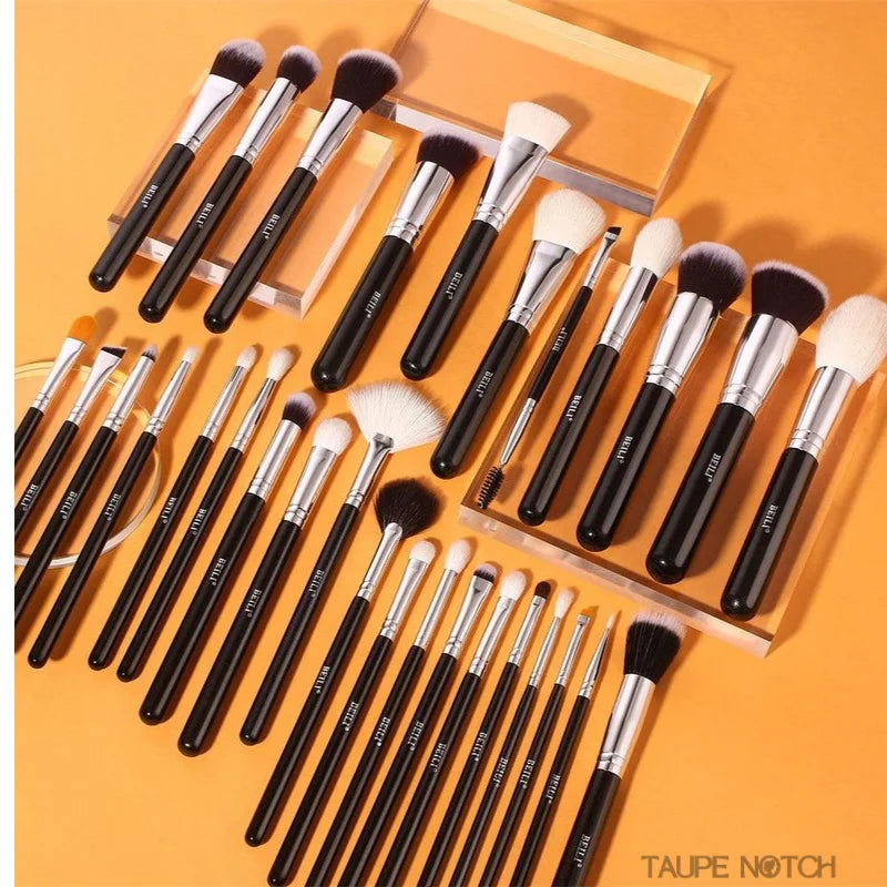 Makeup brush set in a boxed layout with black handles and white bristles