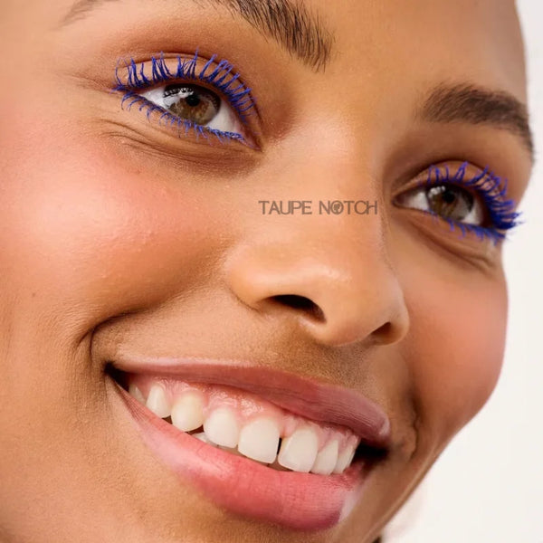 Close-up of face with blue mascara on upper lashes