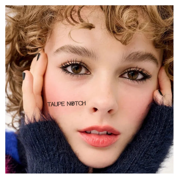 Black eyeliner pencil applied along lash line on model face