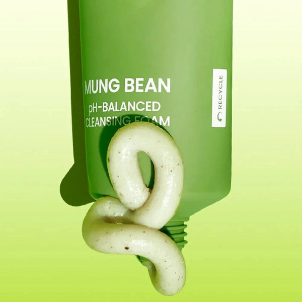 Green cleansing foam tube with swirl of pale foam