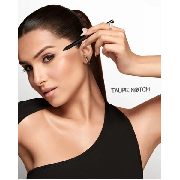 Waterproof kajal eyeliner pencil held near eye during application.