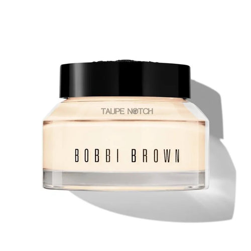 Moisturizer & primer jar with black cap; light tan front label