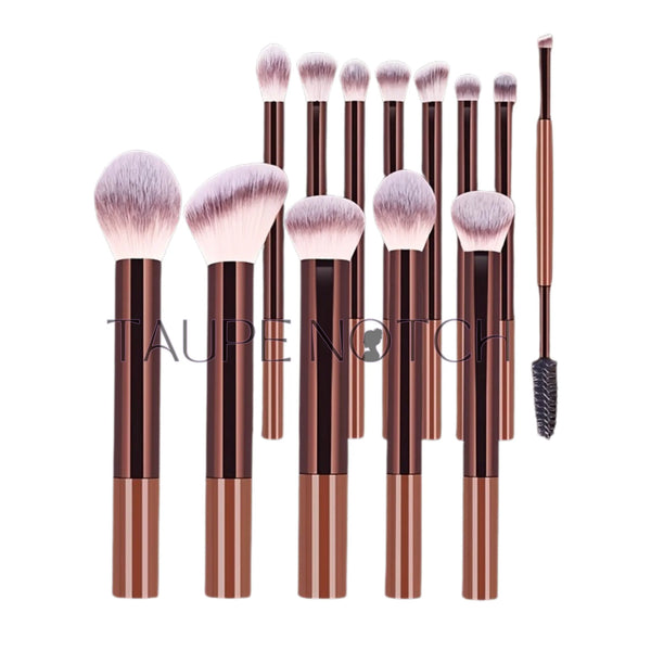 Makeup brush set with purple bristles and striped rose-gold handles, assorted brush shapes