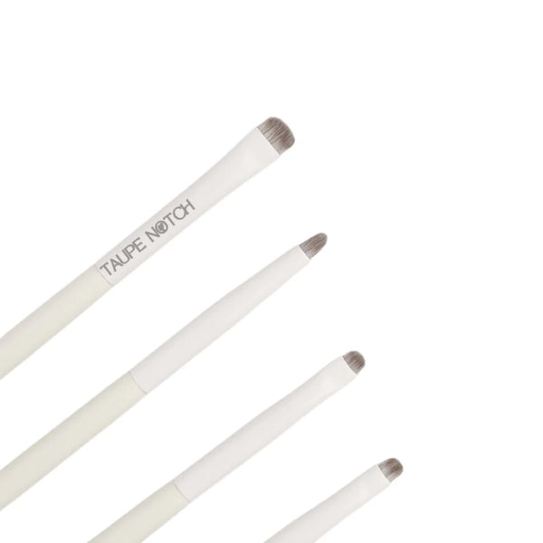 Eye brush set close-up of angled brushes with taupe bristles on white handles