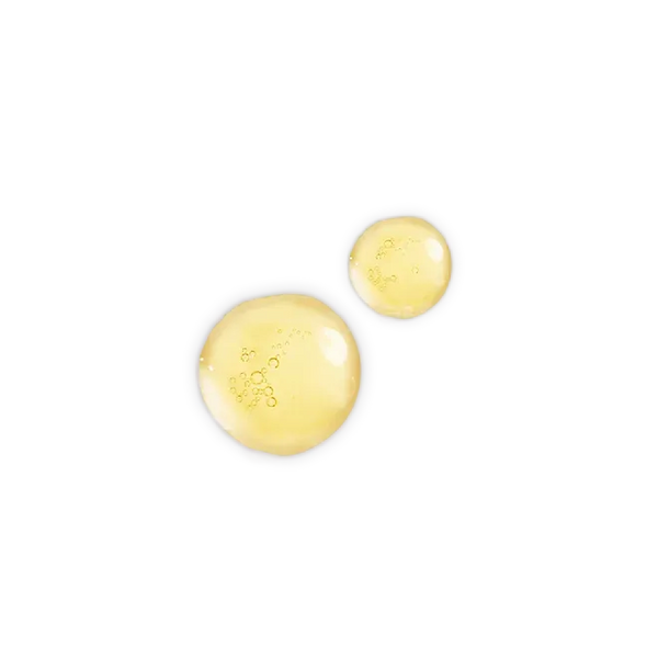 Golden facial oil droplets