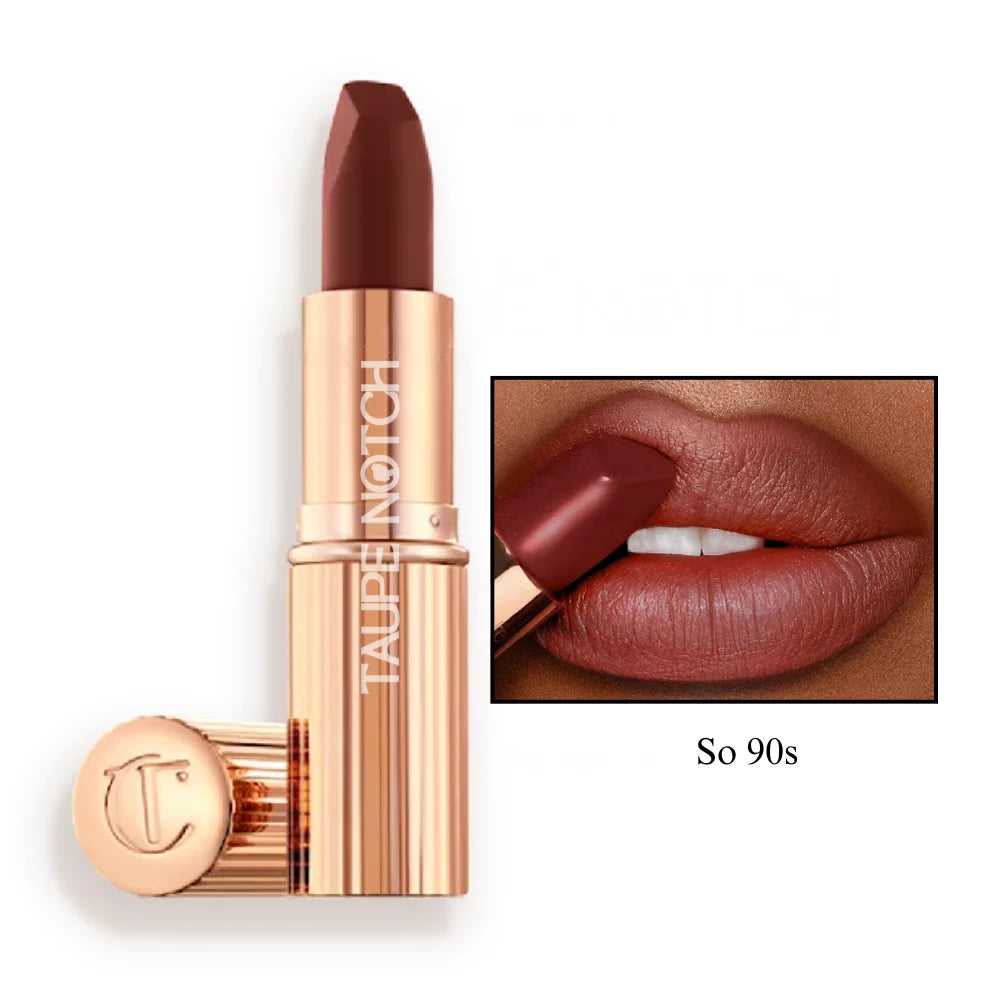 Matte lipstick in dark berry shade, gold-toned tube with matching cap.