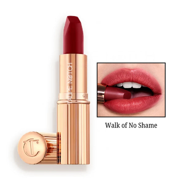 Matte lipstick in vivid red shade, gold-toned tube with matching cap.