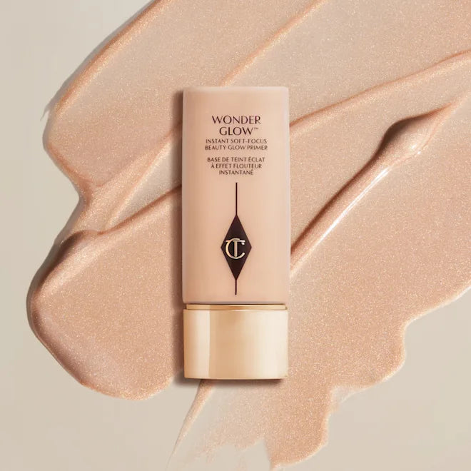 Charlotte Tilbury WonderGlow face primer tube with peach shimmer smear