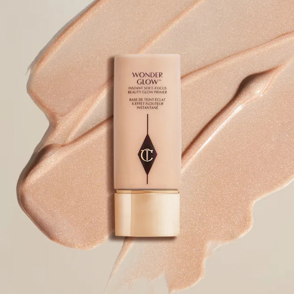 Charlotte Tilbury WonderGlow face primer tube with peach shimmer smear