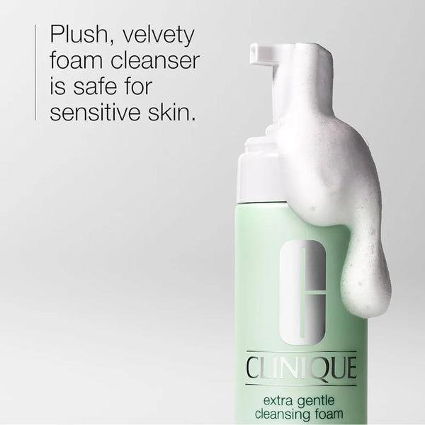 Clinique extra gentle cleansing foam bottle with foamy lather on hand and pump