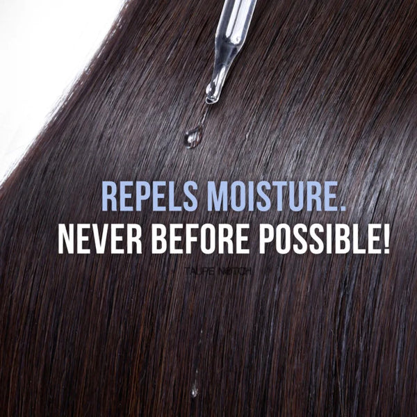 Close-up dark hair strands with silver applicator tip above the scalp