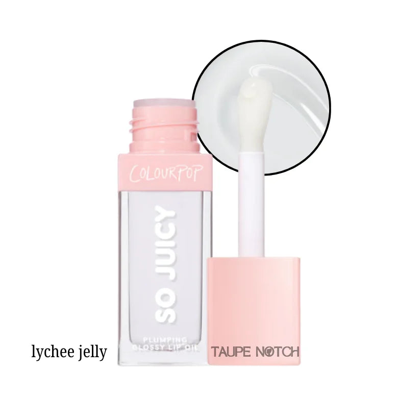 Glossy lip oil in pale cream shade with clear tube and white doe-foot applicator
