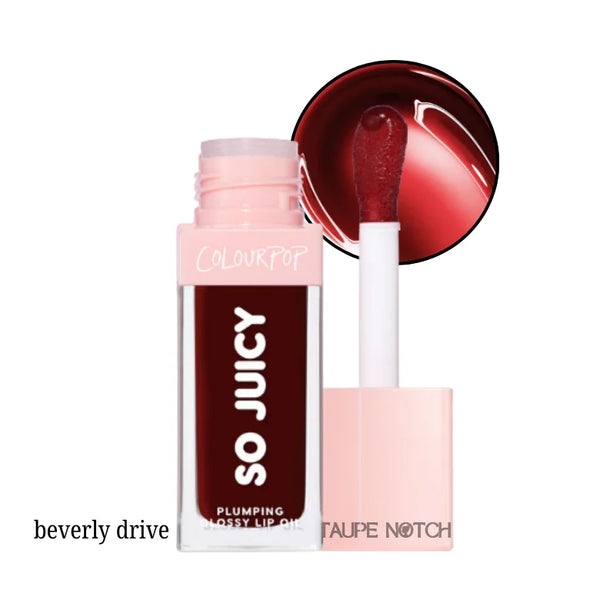 Glossy lip oil in deep berry shade with clear tube and white doe-foot applicator