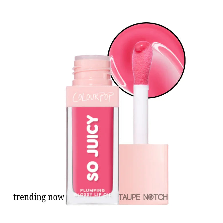 Glossy lip oil in vivid pink shade with clear tube and white doe-foot applicator