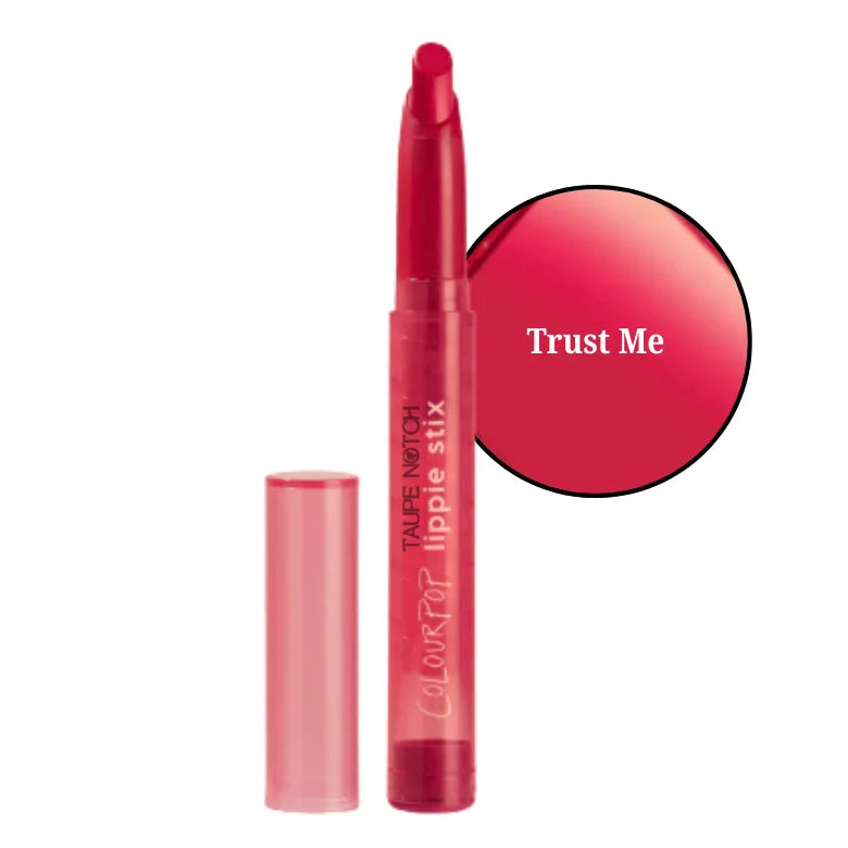 Lipstick in Trust Me bright red shade, clear tube with capped wand