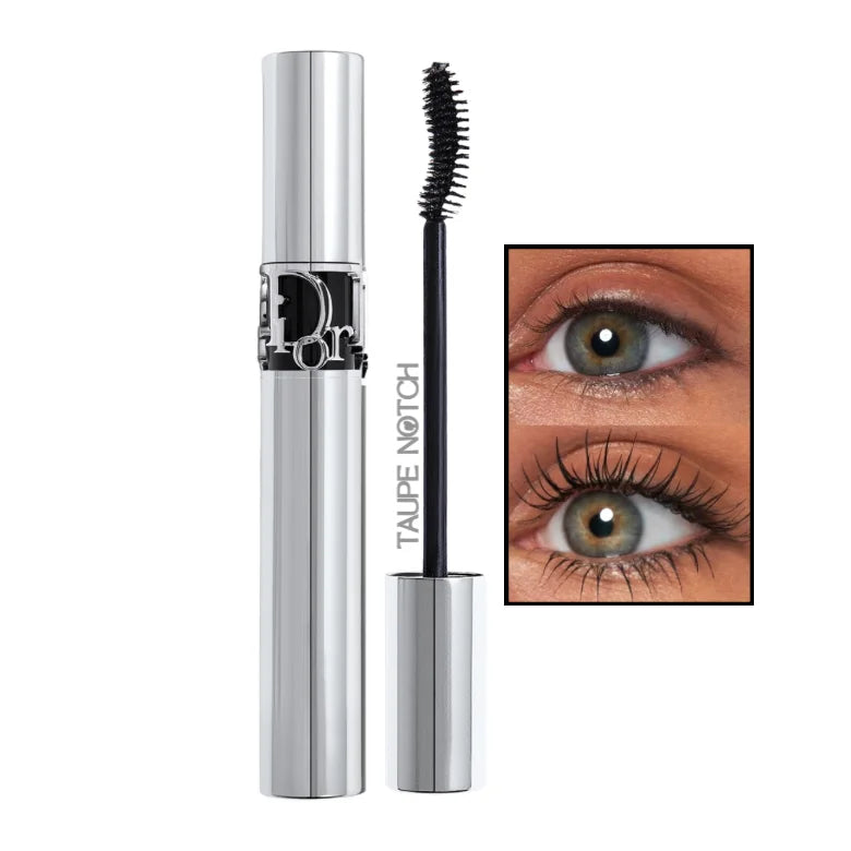 Black mascara with curved wand and silver tube, with long curled lashes close-up