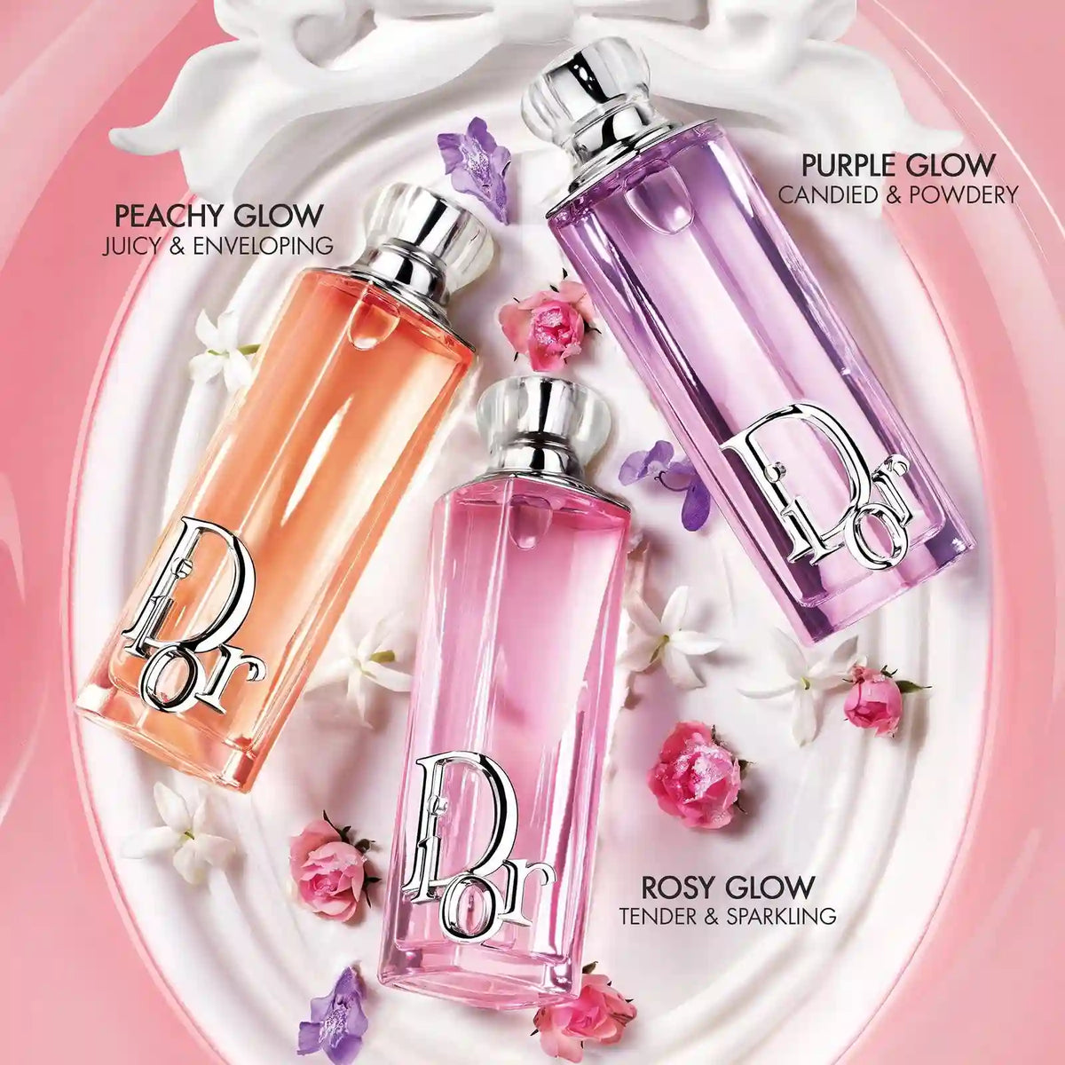 Dior Addict Rosy Glow, peaches glow and purple glow  Eau de Parfum Lying over a plate with some flower