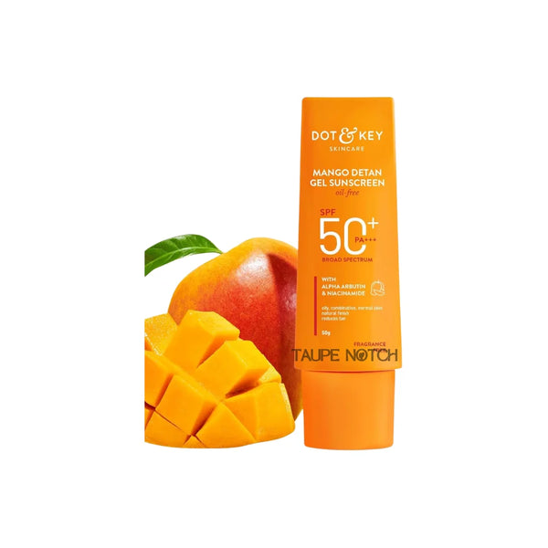 Orange Dot & Key sunscreen gel bottle with SPF 50+ PA+++ beside mango pieces