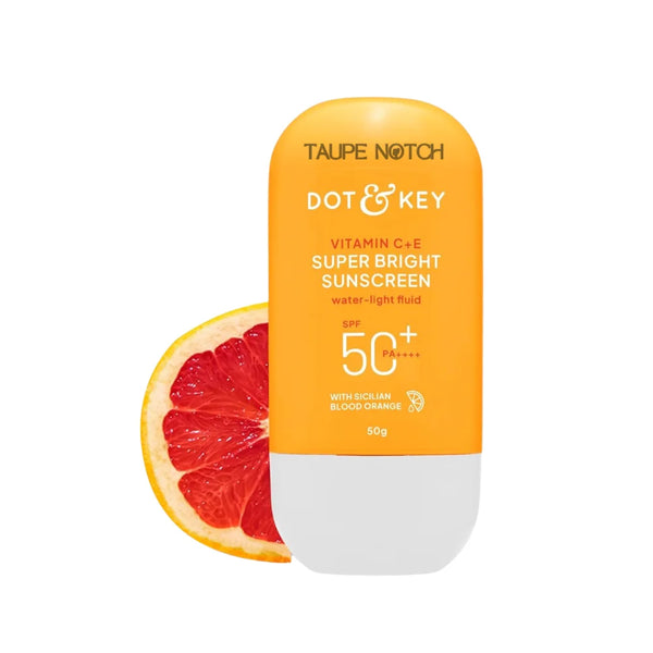 Vitamin C sunscreen bottle with SPF 50+ PA++++, orange/white, 50g, beside citrus slice