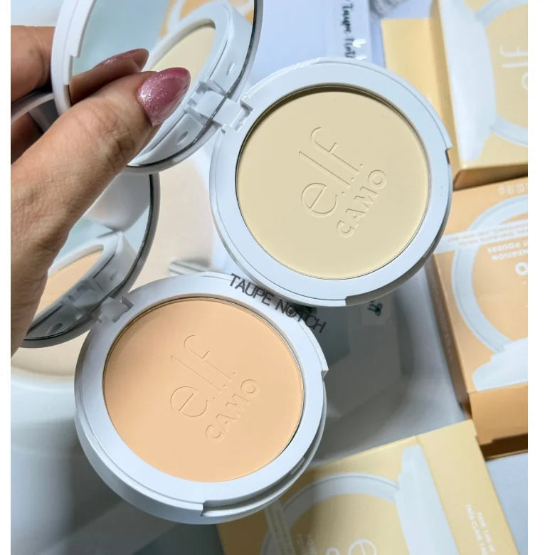 Two powder foundation compacts with light beige pans, one held in a hand