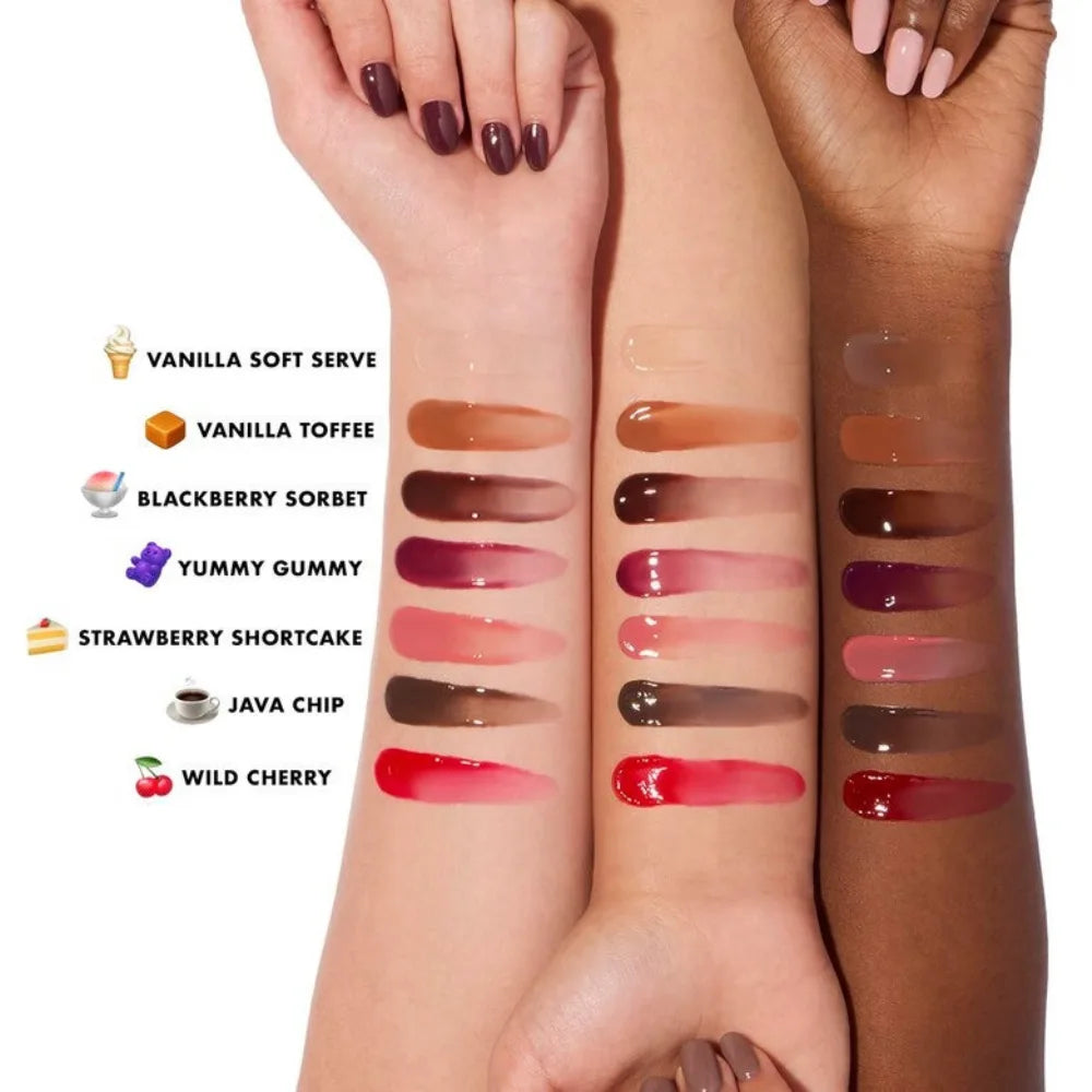 Lip balm color swatches on hands, showing multiple glossy shades