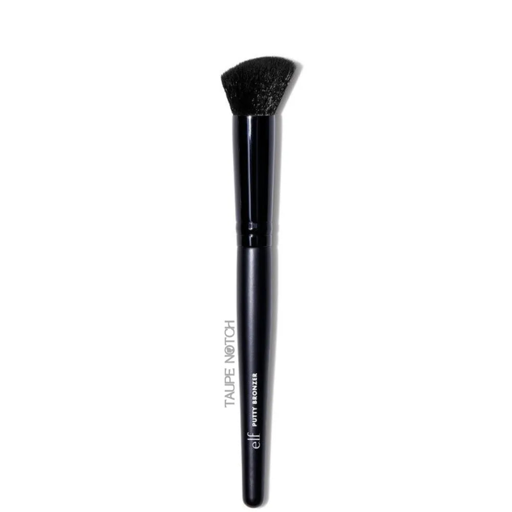 Bronzer brush with tapered black bristles and glossy dark handle