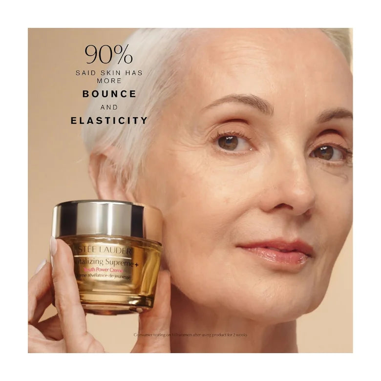 Estée Lauder Revitalizing Supreme+ cream moisturizer jar held near face