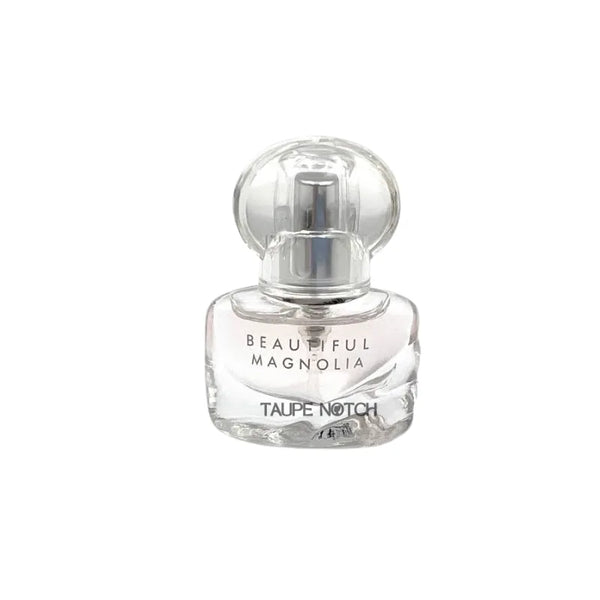 Estee Lauder Beautiful Magnolia eau de parfum spray bottle, clear glass with label