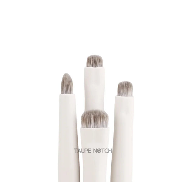 Eye brush set with four brushes, soft taupe bristles and white handles