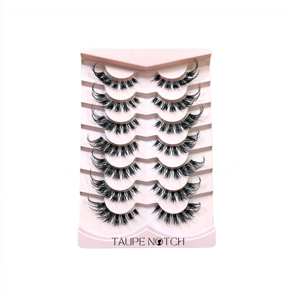 False eyelashes set, pink striped case with multiple black lash pairs and Taupe Notch label