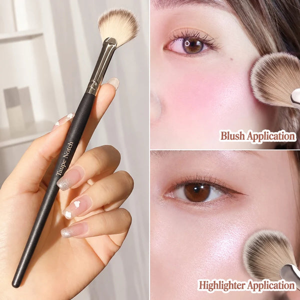 Fan-shaped makeup brush with black handle and beige bristles for blush and highlighter