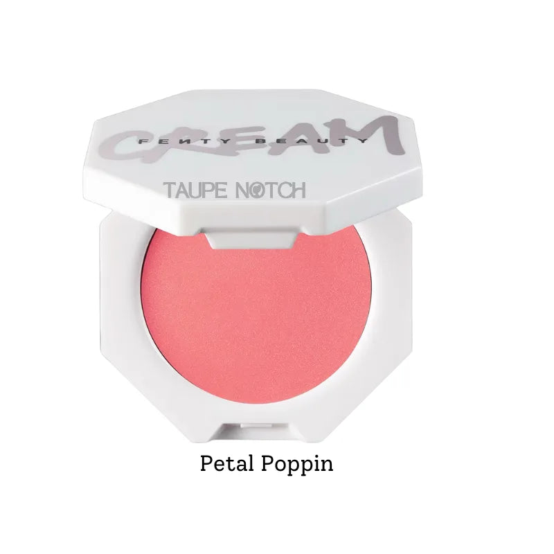 Cream blush in coral-pink shade, shown in white compact with curved base.