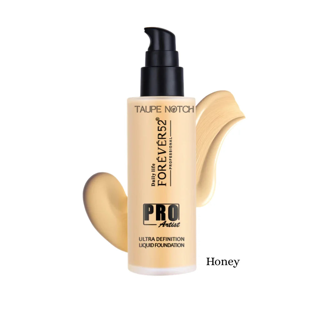 Liquid foundation bottle with warm light beige swatches, shade Honey, black pump, taupe label