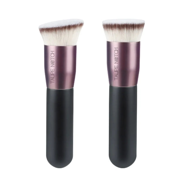 Pair of foundation buffing brushes with rose-pink ferrules, black handles, and soft white bristles