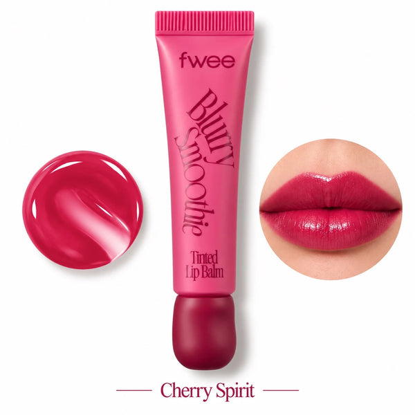 A pink squeeze tube of fwee Blurry Smoothie tinted lip balm labeled Cherry Spirit, shown on a white background with a circular glossy swatch of the pink balm on the left and a circular close-up of lips wearing the deep pink color on the right.