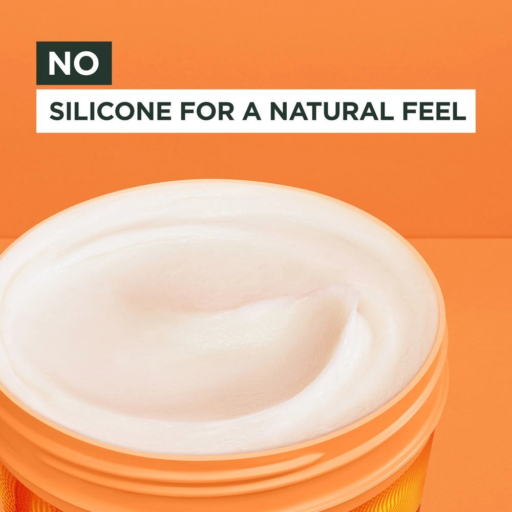 Jar of cream with text 'No silicone for a natural feel' on an orange background