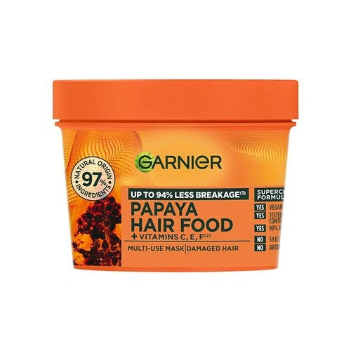 Garnier Papaya Hair Food multi-use mask in a bright orange tub with a matching orange lid, set against a plain white background.