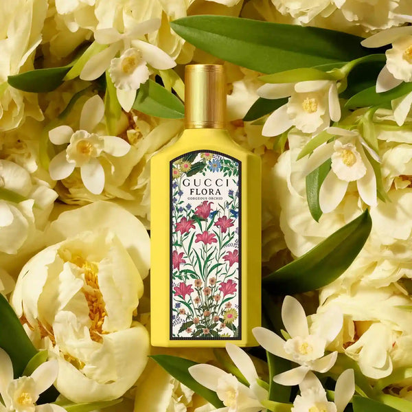Floral EDP perfume bottle with gold cap and botanical label, framed by white flowers