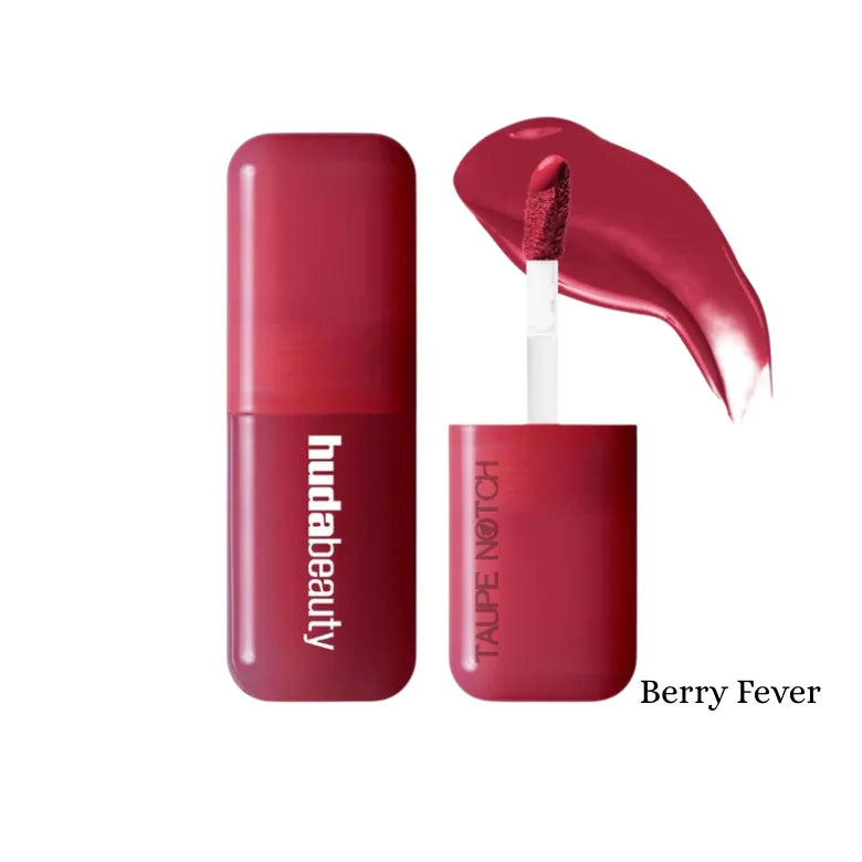 Huda Beauty liquid blush in Berry Fever shade, berry red tube with applicator.